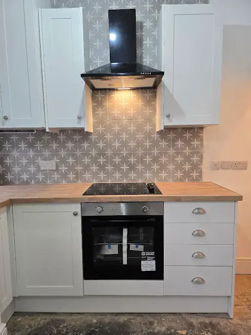 Kitchen cooker hood, hob and oven installation